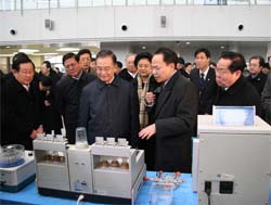 Chinese Premier WEN Jiabao listens to introductions at a biologic products research and development corporation during his visit to Beijing-based Zhongguancun Science Park, known as China's Silicon Valley, on 27 December.